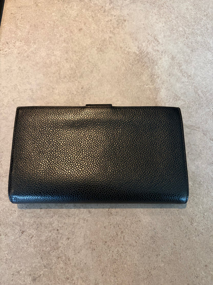 Chanel Timeless CC wallet in black caviar leather, side view