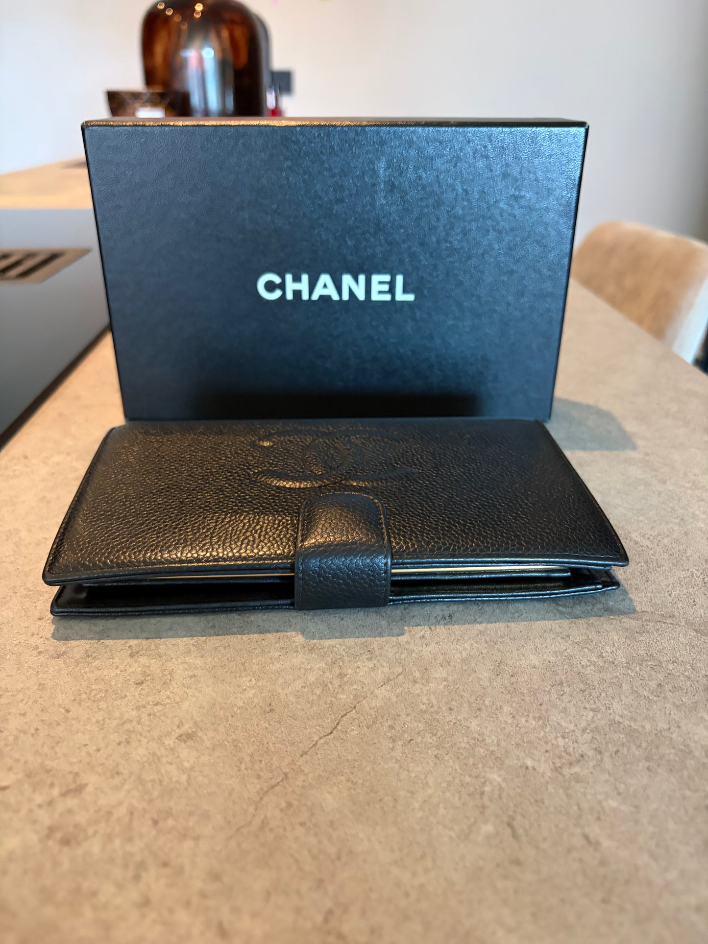 Chanel Timeless CC wallet in black caviar leather, back view